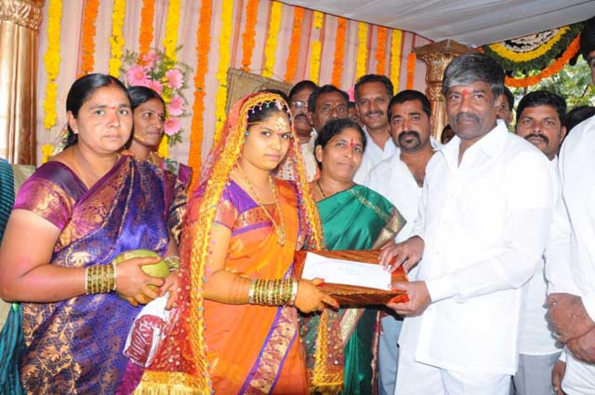 Excise and Prohibition Minister T Padma Rao Goud disbursing Kalyana Lakshmi scheme amount to a beneficiary at Tarnaka in Hyderabad. (File photo)